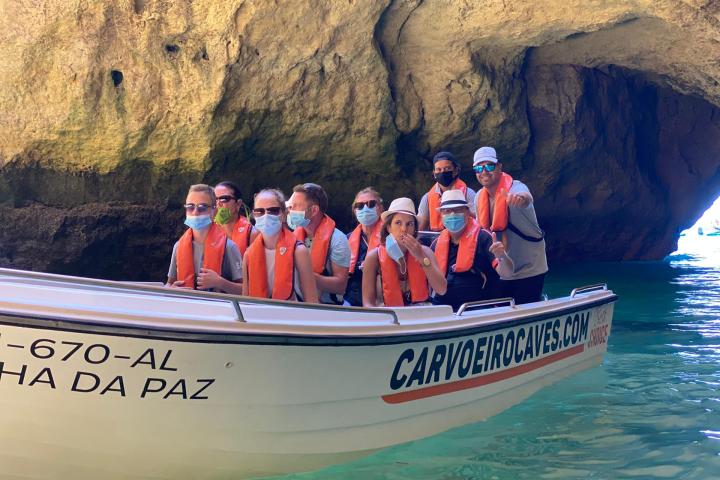 a group of people on a boat in the water